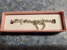 AVON-DANGLE HEART CHARM TENNIS BRACELET-NEW IN PINK GIFT BOX-SILVER TONE