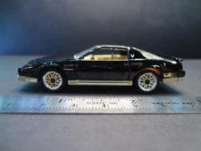 Johnny Lightning 1986 Pontiac Firebird GTA black/gold - Loose 1:64