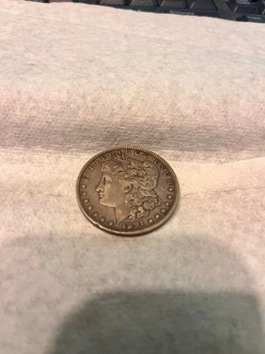 1891 - O Morgan dollar US Dollar coin it will  clean up nicely - I am no expert