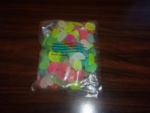 New in bag multicolor pastel stones that glow in the dark light makes them glow