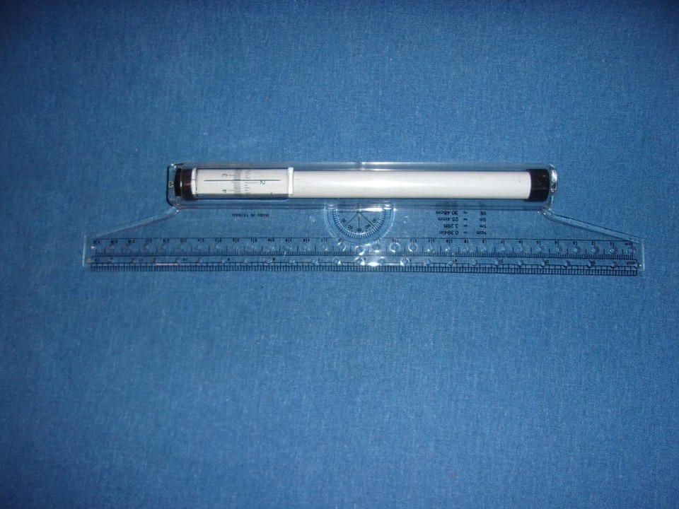 A mysterious vintage drafting ruler that's as much a conversation piece as it is a precision tool — old-school technical cool.