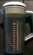 Baby Brezza Gray White Portable One Step Motorized Baby Formula Mixer Pitcher.