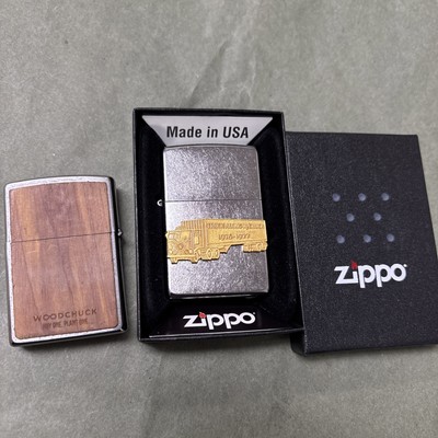 2 very unique zippo lighters, 1 w/ wood panels & 1-truck along w/Chuck Raised Em