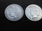 Junk  1884 Morgan and 1923 Peace  silver dollars   g/vg   (free shipping)