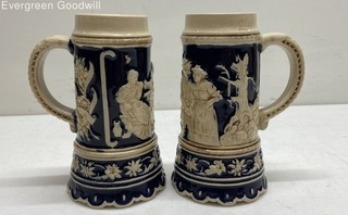 Pair VTG German Beer Stein Cobalt Blue High Relief Hunt and Tavern Scenes