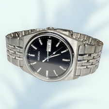 New With Tags SEIKO Mens V743 9029 Day Date Analog SD Case Silver Watch