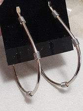 Large hoop Silvertone earrings w/wire coil accents