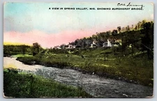 Spring Valley Wisconsin~View Along River~Burghardt Bridge~1908 Postcard