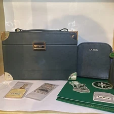 New La Mer Emerald Medium Trunk, Tiny Trunk, Patches, and Keychains