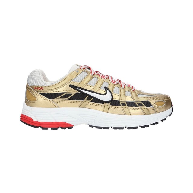 gold nike tennis shoes