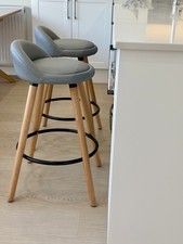 2 Skandi bar stools, grey with solid wood legs, used but in excellent condition