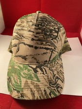Scrub patterned camouflage trucker hat blank front