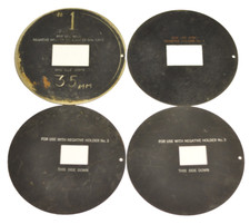 2- two matching pairs of metal discs for negatives. One is 35mm and 1/2 frame .