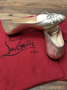 christian louboutin gold flats