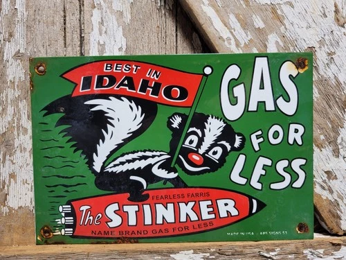 VINTAGE STINKER PORCELAIN SIGN 1953 IDAHO GAS FOR LESS SKUNK GASOLINE STATION