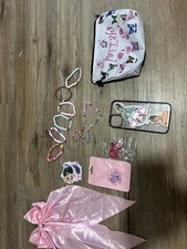Melanie Martinez merch bundle set. stickers, bow, bag, phone case, and jewelry.