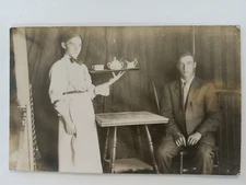 REAL PHOTO POSTCARD 1910 COOK WAITRESS DELIVERING COFFEE OR TEA TO MAN IN TENT