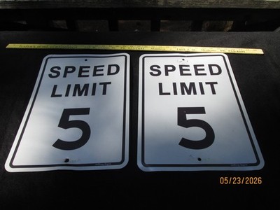 TWO USED 5 MILES AN HOUR SPEED LIMIT SIGNS.