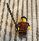 LEGO Minifigure w/ Black Sword, Red Armor Torso, Gray Legs, Black Hair — photo 1