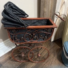 Vintage Victorian-style baby doll carriage, stroller, or buggy