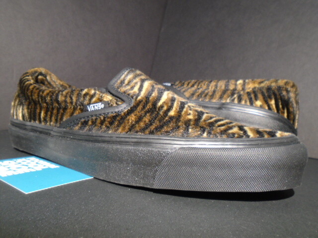 tan slip on vans with fur