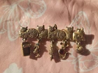 FIVE CATS Vintage costume jewelry marked AJC Gold Tone Articulated Brooch