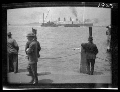 Men on dock watch as unidentified ocean liner passes New Yor - 1900 Old Photo