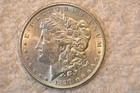 1890  BU MORGAN DOLLAR.