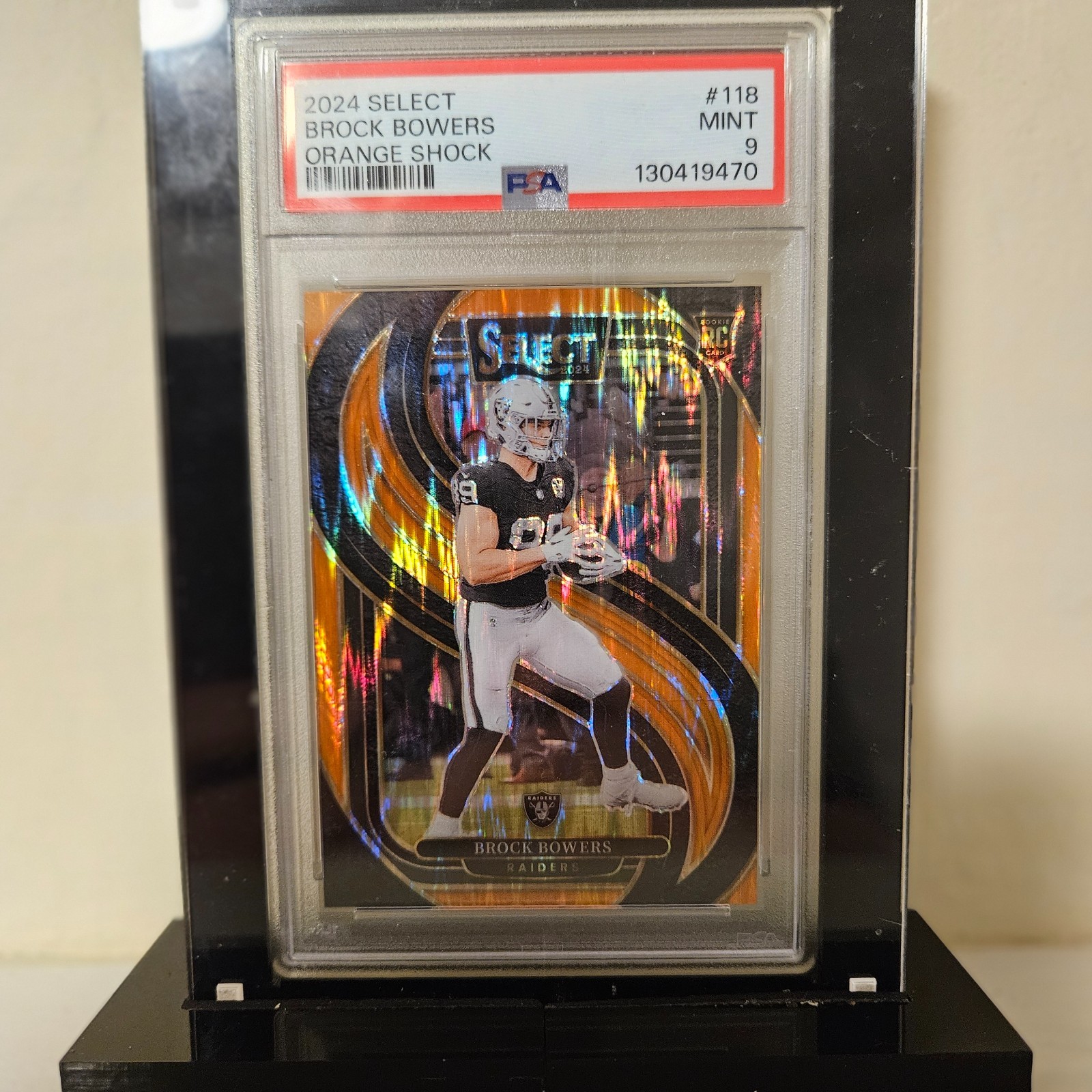 2024 Panini Select Orange Shock #118 Brock Bowers Rookie RC /399 – PSA 9
