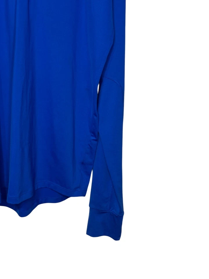 Prendas para el torso Under Armour para hombre 1/4 cremallera agujeros para el pulgar equipo de rendimiento regular azul mediano Foto 2 de 4