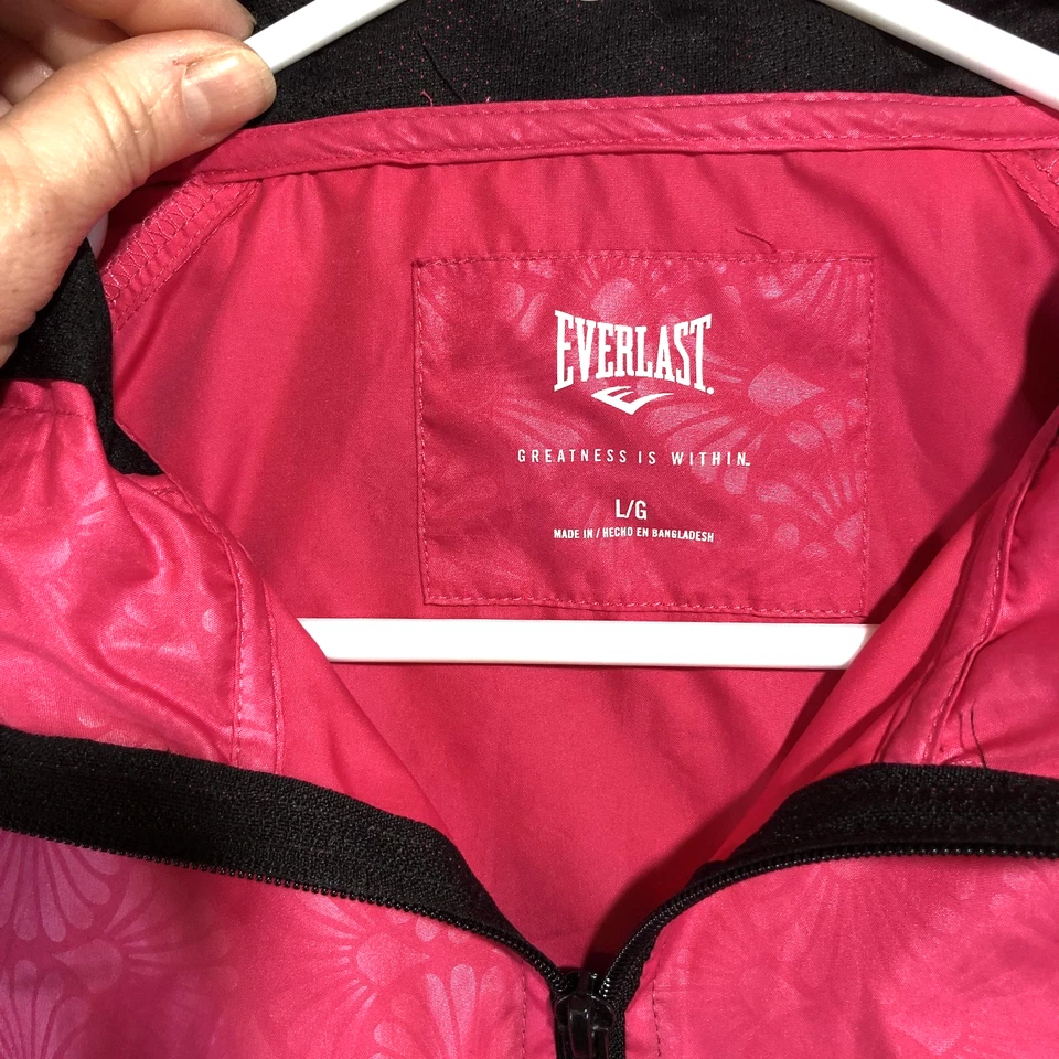 Chaqueta cortavientos Everlast para mujer grande rosa ligera con capucha estampado geométrico Foto 3 de 4
