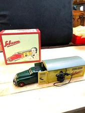 SCHUCO ,CAR ,GARAGE Steel NEVER PLAYED WITH,IN THE BOX.WORKS NEVER USED...