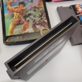 Lot of 8 NES Games Ikari Warriors II Jackal Trojan Strider Captain Comic CIB