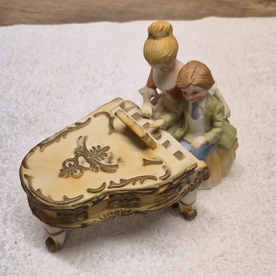 Hand-painted Lenwile Ardalt porcelain music box featuring a woman and boy — Ardalt is a respected mid-century Japanese porcelain brand that genuine collectors actively seek out.