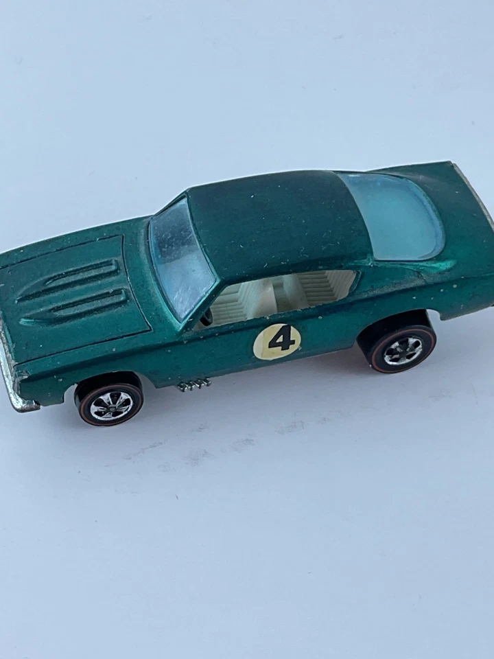 Hot Wheels Value Guide Custom Barracuda HK Aqua 1967 con coche interior beige Foto 2 de 4