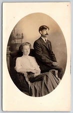 VINTAGE REAL PHOTO POSTCARD OLD ANTIQUE PICTURE FAMILY MAN LADY GIRL CHAIR RPPC