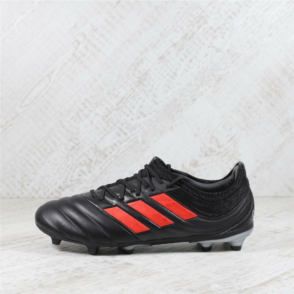 grey and red football boots