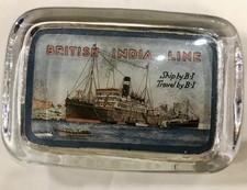 glass paperweight British India line 11cm across 7.5cm high and 2.5cm deep