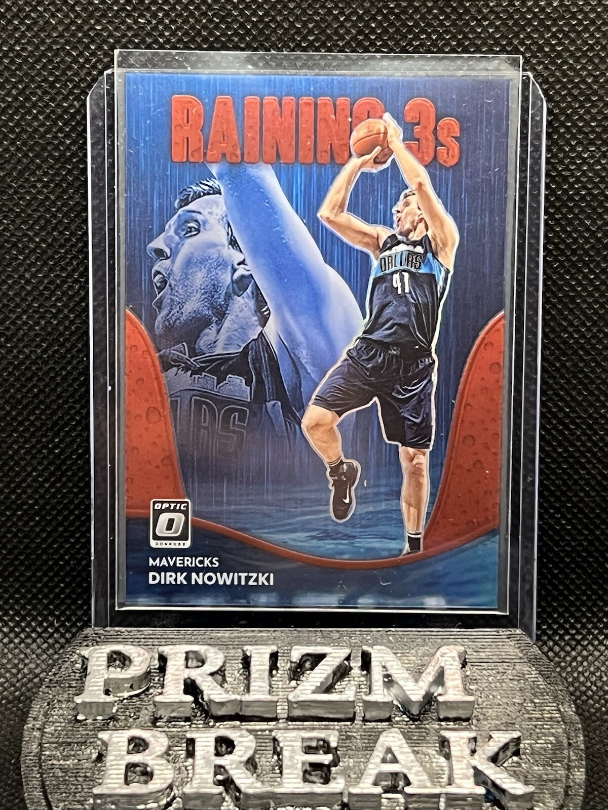 2022-23 Panini DonRuss Optic Dirk Nowitzki Raining 3s Red Prizm /99 #19 Dallas