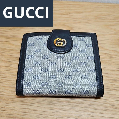 Authentique portefeuille Gucci couleur bleu marine GG Supreme vintage L10,5 x H8,8 x P2 cm