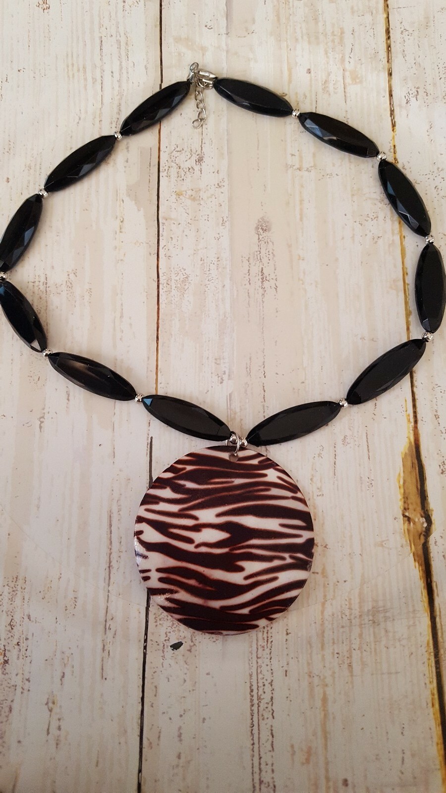 18" black plastic elongated bead with shell pendant fashion necklace