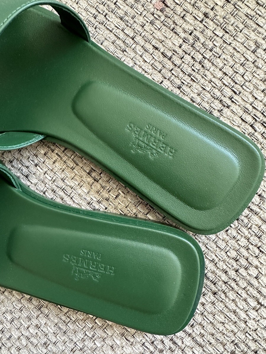 Step into luxury with the Hermès Oran Sandal in Vert Anglais