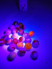 Lot of 24 Cadium filled Glass marbles. Glows red under blacklight