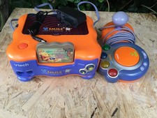 console vsmile orange avec winnie l'ourson +1man+secteur testé et fonctionnelle