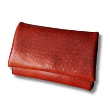 This mini wallet, roughly the same size as a card, features genuine leather, a