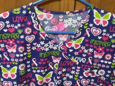 NWT - PINK RIBBON  BUTTERFLY PRINT SCRUB TOP IN SIZE: X-SMALL