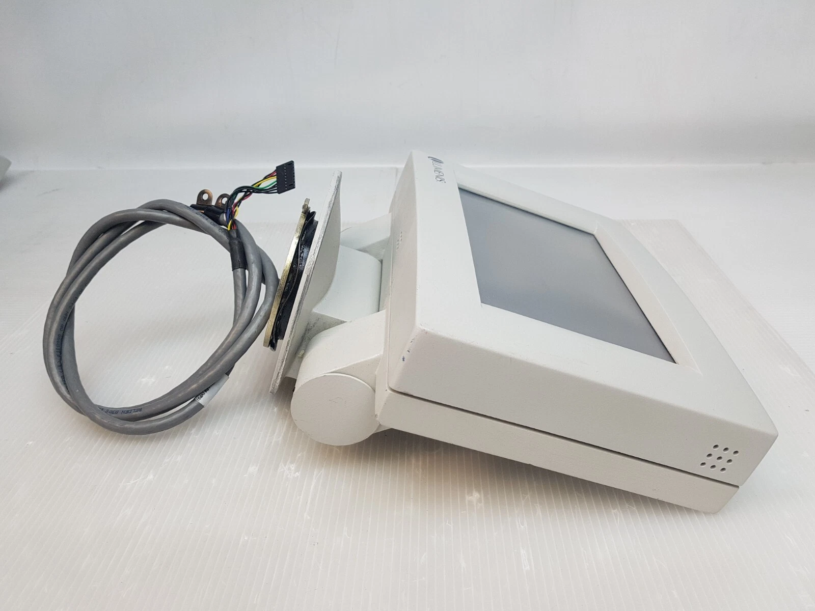 Lumenis 0633-476-01 graphics terminal seen from the side with its stand and cable