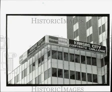 1990 Press Photo Signs of Kemper Service Company placed on top of the building