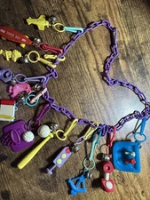 Vintage 80s Plastic Clip On Bell Charm Necklace  12 Charms