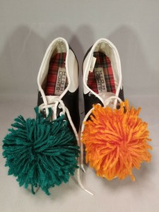 baby shoes with pom poms